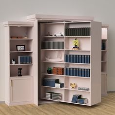 an open bookcase with many books on it in a room next to a wall