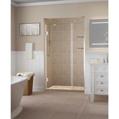 a bathroom with a walk in shower next to a bathtub and sink, along with a television on the wall