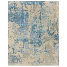 an abstract rug with blue and beige colors