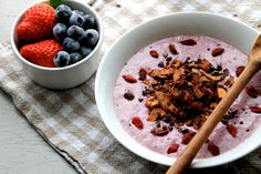 a bowl of yogurt with granola and berries