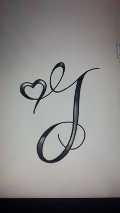 the letter j is made up of black ink and has a heart in it's center