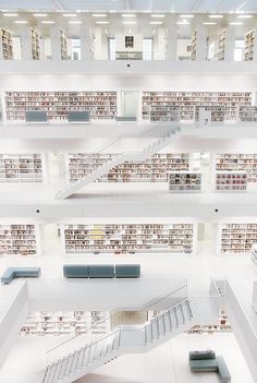 an aerial view of a library with many bookshelves and stairs in the center