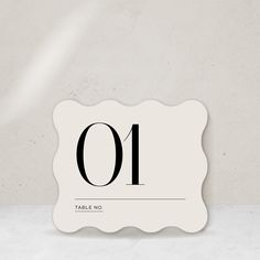 a table number with the number ten on it's front and back side in black ink