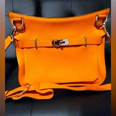 Here's Your Chance To Own A Piece Of Fashion History With This Stunning Hermes Jypsier 34 Handbag In Vibrant Orange. Purchased Back In 2010, This Bag Has Been Stored With Care And Has Never Been Used, Making It A Rare Find For Collectors And Lovers Of Luxury Fashion Alike. Condition: Pristine, Never Used .Color: Eye-Catching Orange, A Bold Statement Piece. Material: Luxurious Taurillon Clemence Leather, Known For Its Softness And Durability. Hardware: Palladium Plated, Adding A Touch Of Modern E Luxury Orange Crossbody Satchel, Luxury Orange Satchel With Detachable Strap, Luxury Orange Bag With Gold-tone Hardware, Luxury Orange Bags With Silver-tone Hardware, Orange Bags With Palladium Hardware, Orange Bags With Silver-tone Hardware, Orange Travel Bag With Silver-tone Hardware, Luxury Orange Pouch Shoulder Bag, Luxury Orange Shoulder Bag