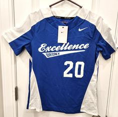 Nike Women's Softball Jersey Blue & White Pullover Excellence Bronx #20 NWT S Blue & White Nike Jersey with Excellence Bronx 20 on the front and #20 on the back (lettering is vinyl printed).  New with tags.  Size Small.  Chest measures approx 18.5" across and 25.5" long.   Please ask any questions prior to bidding.  All items are from a non-smoking home. Will be expertly packaged and shipped. Please see photos and ask any questions if you are unsure or need more details.  Please read below regarding payment and shipping.   SHIPPING    Handling time is 1 day but your item may ship sooner. We ship packages Monday - Friday only, with the exception of holidays. We do combine shipping.  You will be refunded any overages.   We will ONLY ship to the address on file with ebay (NO EXCEPTIONS). Befo Varsity Blue Top For Team Events, Blue Varsity Tops For Team Events, Varsity Blue Tops For Team Events, Nike Varsity Top For College, Nike Blue Collegiate Tops, Softball Jerseys, White Pullover, Nike Jersey, White Nike