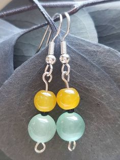 These earrings feature a small white crackle glass bead with a larger matte pink glass bead. The second option is a set of dangle earrings with a yellow and aqua glass bead. Life can also be busy, but either of these are perfect for a quick and effortless look!  Fishhook earrings are nickel free. Jade Beaded Earrings For Jewelry Making, Jade Beaded Dangle Earrings For Gift, Jade Beaded Earrings With Ear Wire For Gifts, Jade Beaded Earrings With Ear Wire As Gift, Beaded Jade Earrings As A Gift, Jade Beaded Earrings As Gift, Adjustable Jade Beaded Earrings As A Gift, Adjustable Round Beads Jade Earrings, Jade Earrings With Dangling Beads As A Gift