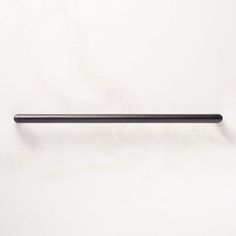 a black handle on a white wall