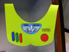 a green safety vest with some stickers on it