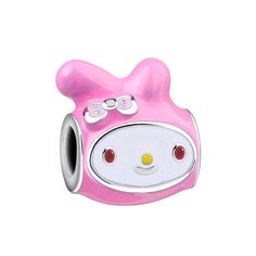 a pink hello kitty charm bead with eyes and ears on the end of it