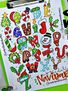 a clipboard with christmas themed writing on it next to some markers and marker pens