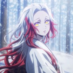 a woman with red hair and yellow eyes standing in front of snow covered trees, looking at the camera