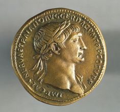 a gold coin with an image of a woman's head