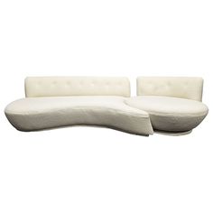 a white couch sitting next to each other