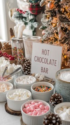 a table topped with lots of different types of desserts and marshmallows