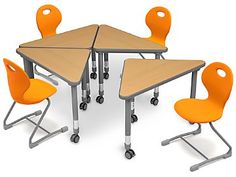 a group of desks with orange chairs around them and one chair in the middle