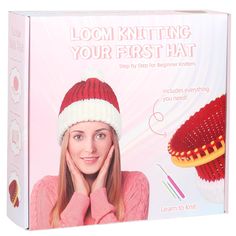 a woman wearing a red and white knitted hat next to a box of knitting kits