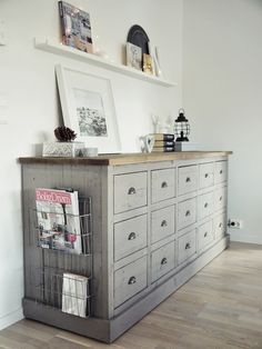 an old dresser is turned into a magazine rack