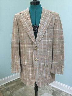 "Men's Plaid Sport Coat ~ Made by Scottsdale ,Jacksonville ,Fl Colors of brown,cream,rust orange,yellow,and blue Partly inlined interior Wool blend Large wide lapels at 4 1/2\" 2 Button front closure 3 Small buttons at cuffs Large 3\" flaps over front pockets 2 Interior chest pockets 11 1/2\" Kick pleat at back Well made and in Excellent Vintage Condition    Size 42 Shoulders -17\" Sleeves -23 1/2\" Chest - 42 Waist buttoned - 39 1/2\" Length -29\" Great Jacket No damages No Odor !" Brown Flat Front Suit For Fall, Brown Flat Front Suits For Fall, Retro Single Breasted Tweed Jacket, Vintage Brown Tweed Jacket With Lapel Collar, Retro Single-breasted Tweed Jacket, Vintage Brown Tweed Jacket With Welt Pockets, Vintage Outerwear With Suit Collar For Fall, Vintage Fall Outerwear With Suit Collar, Beige Flat Front Sport Coat For Fall