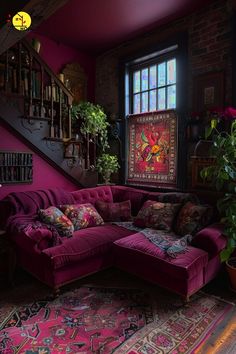 a living room with purple couches and rugs in front of a staircase case