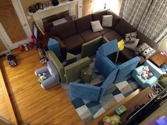 an aerial view of a living room with couches, chairs and other furniture in it