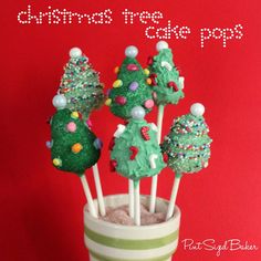 christmas tree cake pops in a cup with sprinkles and candy on top