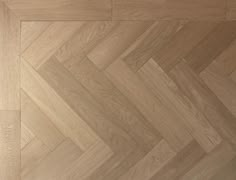 an image of wood flooring that looks like herringbones