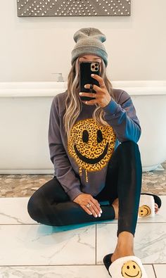 Leopard Smiley Face Sweatshirt features a leopard smiley face. Oversized fit. Plus long enough to wear with leggings! 100% French Terry Cotton Trendy Smiley Face Tops For Loungewear, Trendy Smiley Face Loungewear Tops, Casual Winter Tops With Smiley Face, Casual Smiley Face Winter Tops, Relaxed Fit Smiley Face Top For Loungewear, Smiley Face Top For Loungewear, Fun Oversized Sweatshirt For Loungewear, Long Sleeve Smiley Face Top For Fall, Fall Smiley Face Long Sleeve Sweatshirt