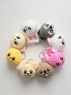 small crocheted keychains are arranged in the shape of rabbits and hamsters