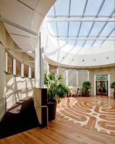 the inside of an office building with wood floors