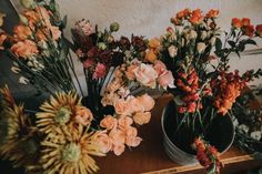 several different types of flowers on a table