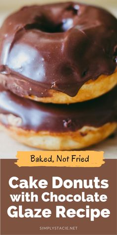 two chocolate donuts stacked on top of each other