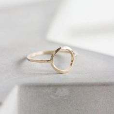 This circle ring represents the best traditions of minimalist jewelry - it is absolutely simple, but this simplicity is really beautiful. It looks gorgeous worn alone or in addition to other pieces. Wear it as a midi ring and as a regular ring - it will look awesome anyway.The ring is 1 mm thick and is very sturdy although it looks very dainty on the finger. The circle is approx. 10 mm diameter, so consider that it could look different on your ring size.You may order the ring of any size. If you Minimalist Circle Jewelry In 14k Gold Filled, Modern Gold Sterling Silver Midi Rings, Modern Yellow Gold Midi Rings In Sterling Silver, Modern Yellow Gold Sterling Silver Midi Rings, Minimalist Open Circle Everyday Jewelry, Minimalist Everyday Open Circle Jewelry, Everyday Minimalist Open Circle Jewelry, Modern Open Circle Jewelry With Ring Detail, Minimalist 14k Gold Jewelry With Halo Design