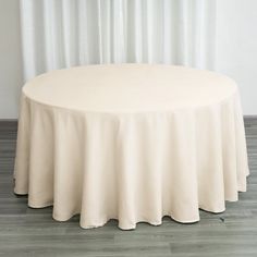 a round table with a white cloth on it