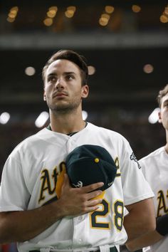 two baseball players standing next to each other