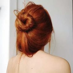 the back of a woman's head with red hair