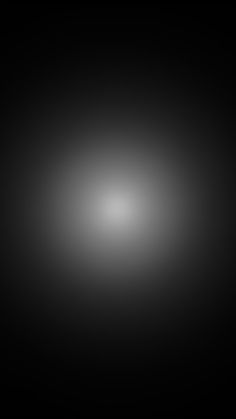 a black and white image of a light in the dark