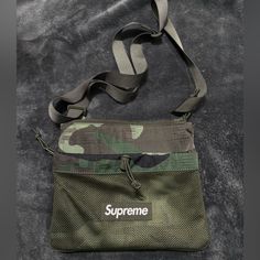 Supreme Camo Side Bag Brand New Enough Space Casual Bags With Flat Pocket For On-the-go, Casual On-the-go Bag With Flat Pocket, Casual Crossbody Bag With Flat Pocket, Casual Shoulder Bag Pouch For Errands, On-the-go Satchel Bag With Flat Pocket, Functional Satchel Bag With Dust Bag, On-the-go Shoulder Bag With Flat Pocket, Functional Satchel With Dust Bag, Functional Satchel With Dust Bag Included