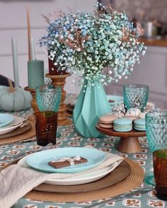 the table is set with blue and white dishes