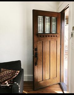 a wooden door sitting inside of a living room