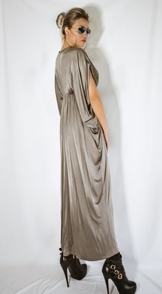 NEW Taupe Gold Maxi Dress / Plus Size Dress / Draping Dress / Loose Dress / Extravagant Maxi Dress / Long Dress / Boho Dress #35378 SEE COLOR CHART HERE : https://www.etsy.com/listing/235259897/viscose-color-chart?ref=shop_home_active_4 - Handmade item - Materials : crystal jersey * Please Note : To keep a stock of a large variety of colors, they may have slight differences in weight and drape - The model wears : size - small , color - Off Black - Fit : Loose fit - Length : 130 cm / 51 inches . Maxi-length Dress With Draped Sleeves For Evening, Maxi Length Dress With Draped Sleeves For Evening, Long Evening Dresses With Draped Sleeves, Long Dress With Draped Sleeves For Party, Long Dresses With Draped Sleeves For Party, Dress Draping, Dress Extravagant, Draping Dress, Maxi Dress Plus Size