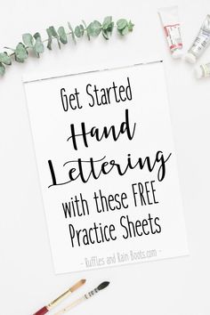 a sign that says get started hand lettering with these free practice sheets next to paints and paintbrushes