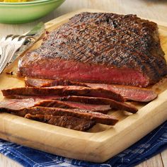 the steak is ready to be cooked on the cutting board and served with french fries