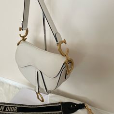 Long Strap Box Dustbag Ribbon Included Elegant White Satchel Saddle Bag, Elegant White Shoulder Saddle Bag, Elegant Saddle Bag With Branded Hardware For Daily Use, Elegant White Saddle Bag With Detachable Strap, Elegant White Rectangular Saddle Bag, Luxury White Saddle Shoulder Bag, Elegant White Saddle Bag, Saddle Bag, Dior Bag