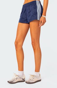 Build your best athleisure looks yet with these swishy, lightweight shorts cut from pure nylon and detailed with sporty stripes at the sides. Elastic waist 100% nylon Machine wash, dry flat Imported Edikted Shorts, Athleisure Looks, Nylon Shorts, Quoi Porter, Skandinavian Fashion, Summer Lookbook, Navy Blue Shorts, T B, Lightweight Shorts