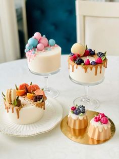 three desserts are sitting on the table ready to be eaten