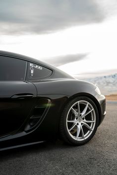 a black sports car parked on the road