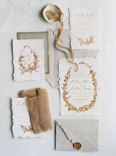 the wedding stationery is laid out and ready to be put into their guests'bags