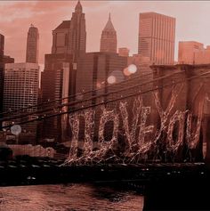 an image of a city skyline with the word love spelled out in graffiti on it