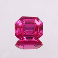 a large pink diamond sitting on top of a table