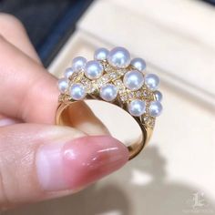 Highline: Famous Style Product Information OriginJapan MaterialAkoya Pearl, 18k Gold, and Natural Diamonds DimensionsRing Weight 12.0 g Pearl Shaped: Round Size: 2.5-4.5 mm Quality: AAA Nacre: Very Thick Color: White Luster: Very High Accessories Metal: 6.1 g of 18k Gold Other: 0.52 ct of SI Quality Natural Diamonds Luxury Cluster Yellow Gold Diamond Ring, Luxury Gold Cluster Diamond Ring, Akoya Pearl Rings With Diamond Accents, White Akoya Pearl Rings With Diamond Accents, Luxury Akoya Pearl Ring For Anniversary, Luxury Diamond White Brilliant Cut Pearl Ring, White Akoya Pearl Diamond Ring With Brilliant Cut, Luxury Pearl And Diamond Ring With Brilliant Cut, Fine Jewelry Yellow Gold Rings